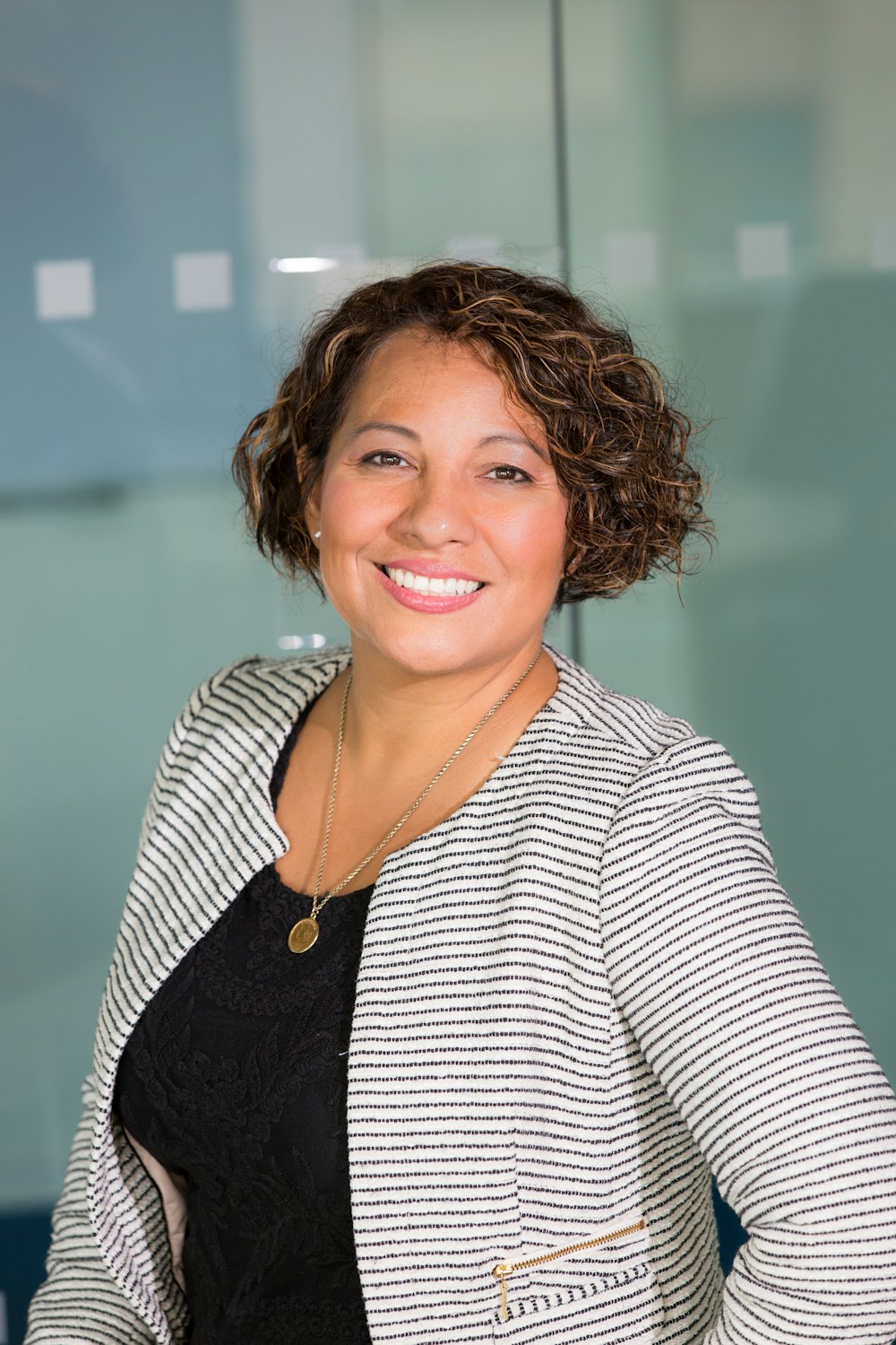 Business owner at her office desk during a marketing progress check-in